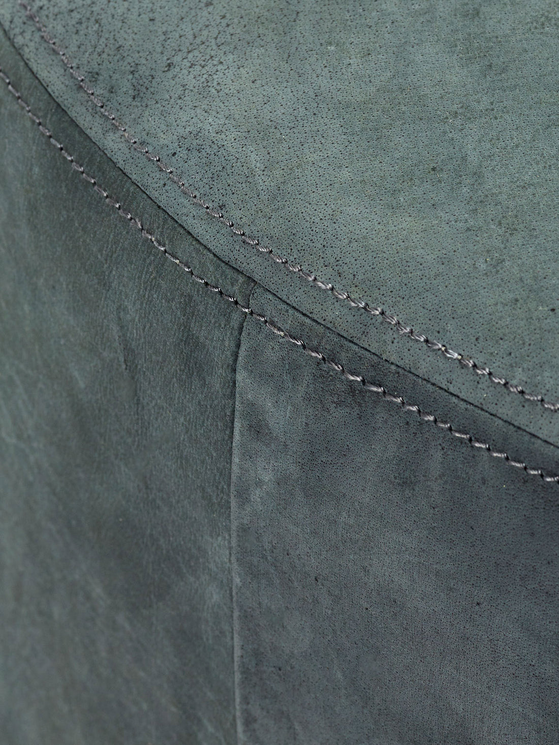 Dark grey leather pouf